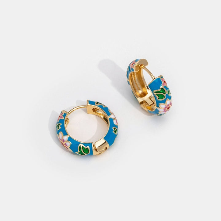 MARAIS | BOUCLES D’OREILLES EN CERCLE DORÉ AVEC FLEUR